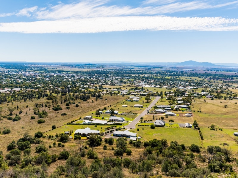 Aerial view of semi-rural NSW development showing housing clusters and open land, illustrating land use governed by NSW planning laws.