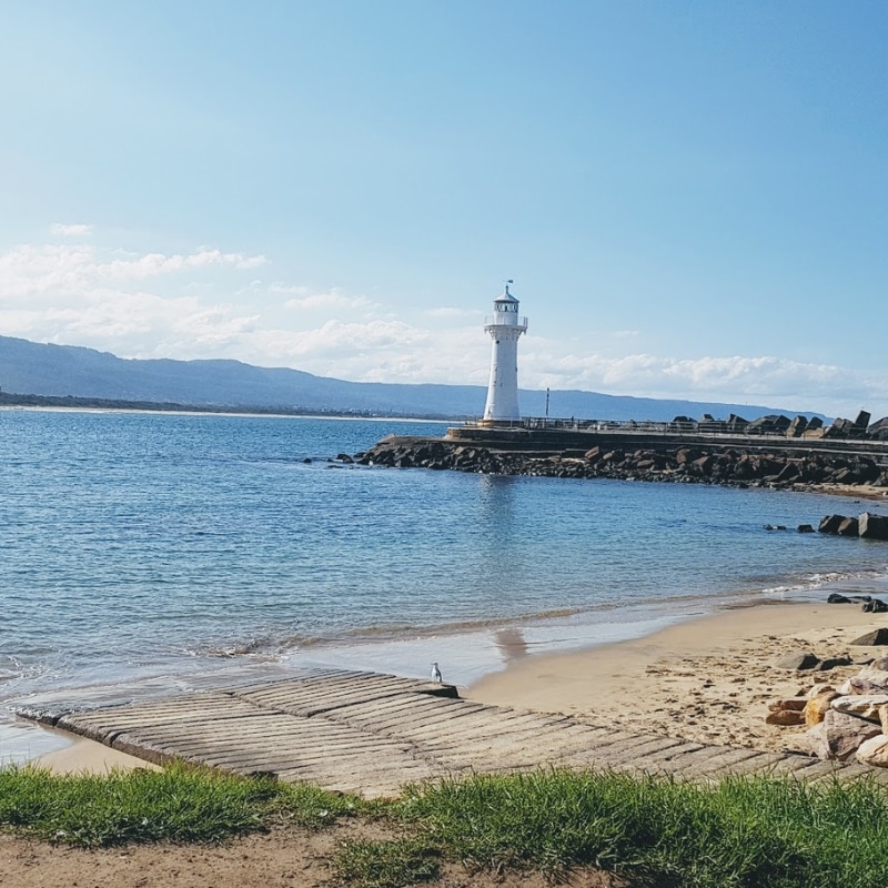 Lighthouse and coastal landscape illustrating Town Planning Wollongong with waterfront access and maritime heritage.