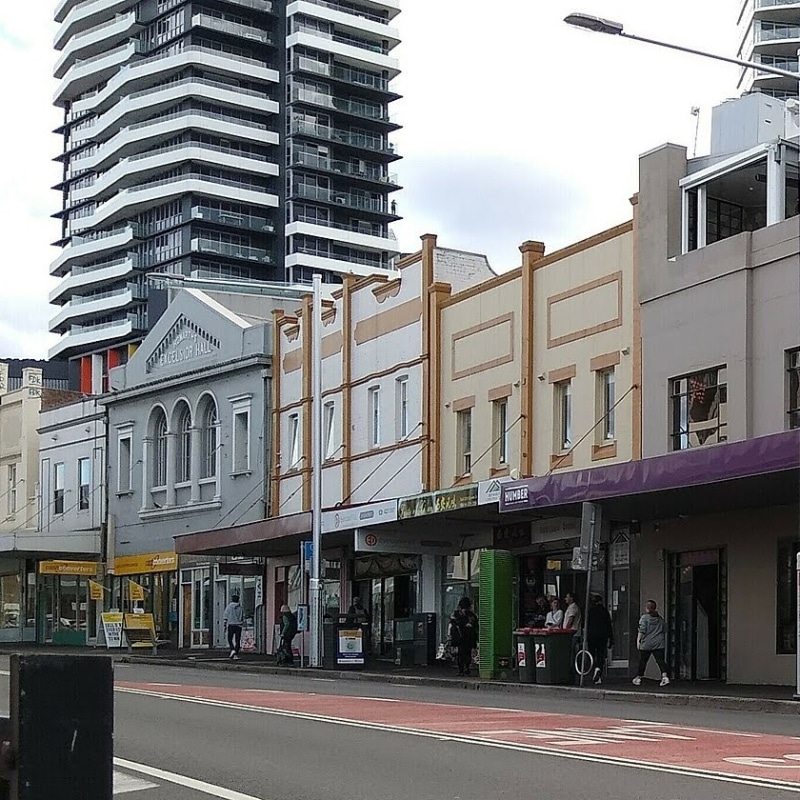 Streetscape showing Town Planning Process in Wollongong with heritage buildings and modern high-rise development.